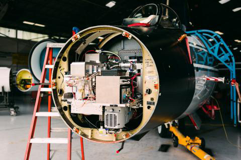 An instrument is exposed in the nose cone of the WB-57 aircraft.