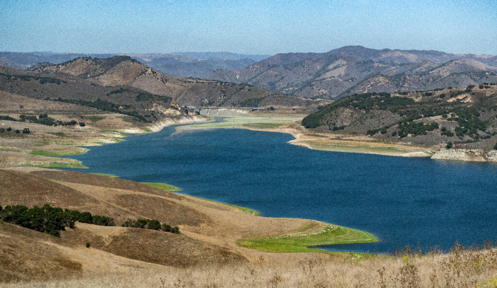 A wide view of Southern California’s Twitchell Reservoir and the surrounding hilly landscape