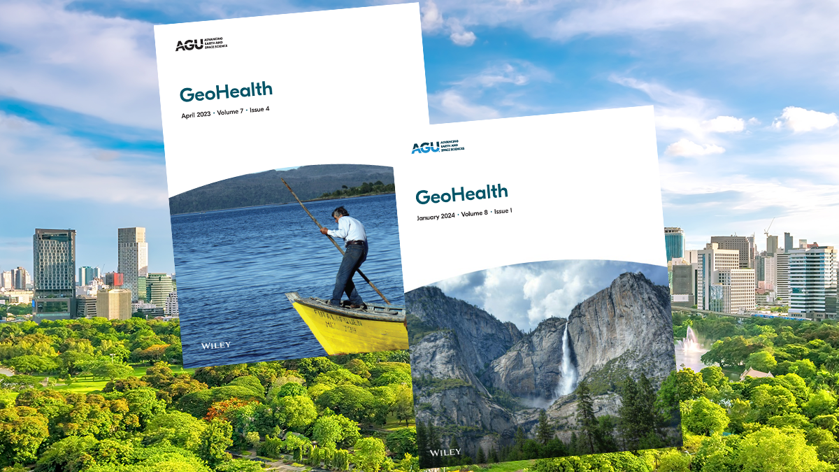 Two GeoHealth journal covers in front of a green park with a city in the background.