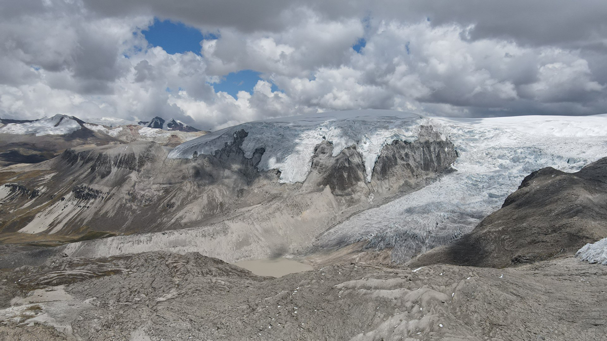 Photo of a glacier sitting on top of rock.