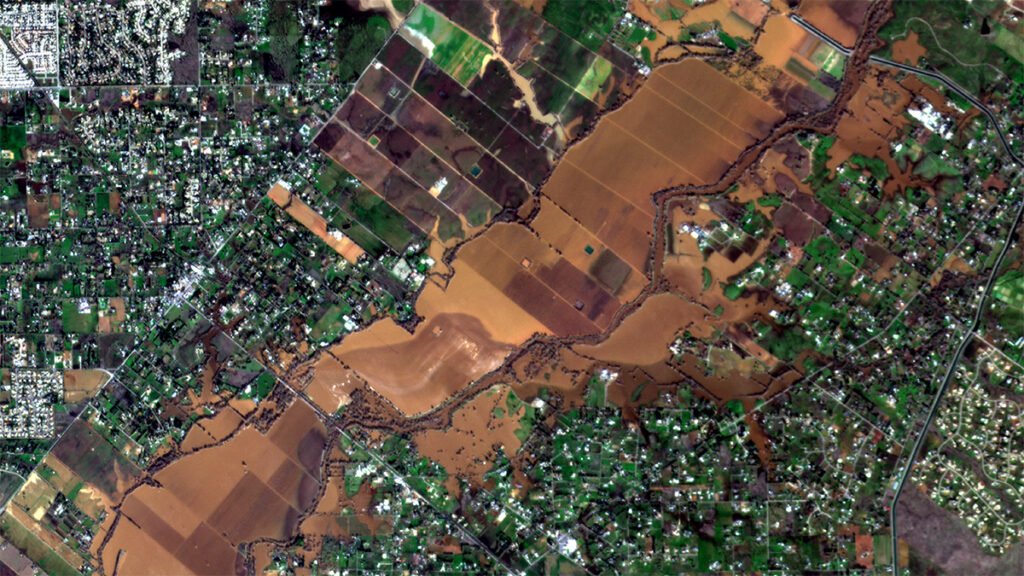 Satellite view of flooding and nearby communities along the Consumnes River in California