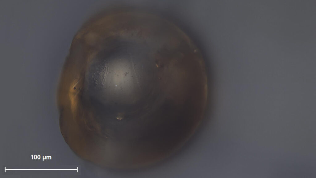 A glass sphere seen through a magnifying lens.