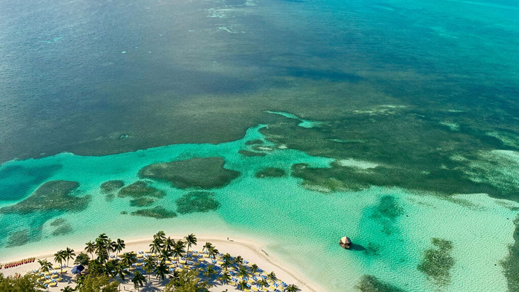 Aerial photo of the Bahamian coastline with the ocean and a sandy shoreline