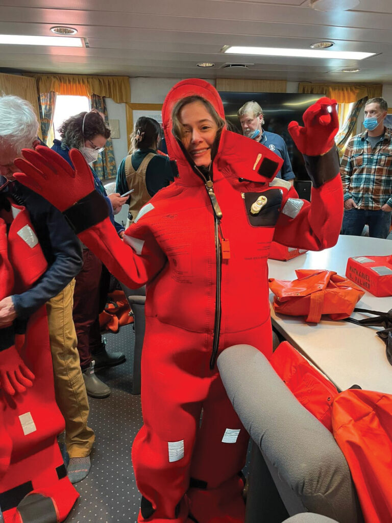 The author poses in her emergency floating suit designed for the icy waters of the Southern Ocean.