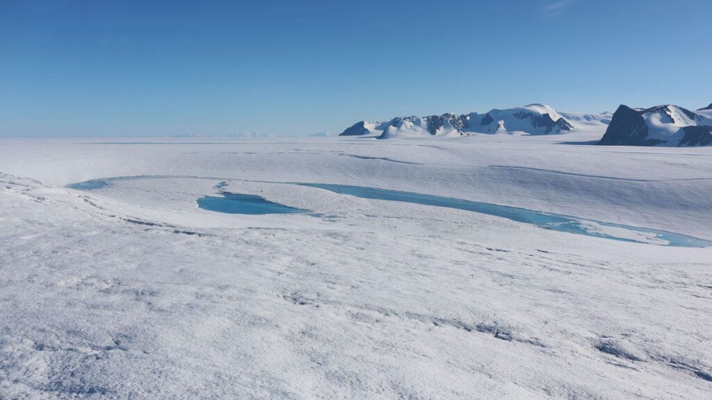 A meltwater lake surrounded by a ring fracture on Antarctica’s George VI ice shelf.