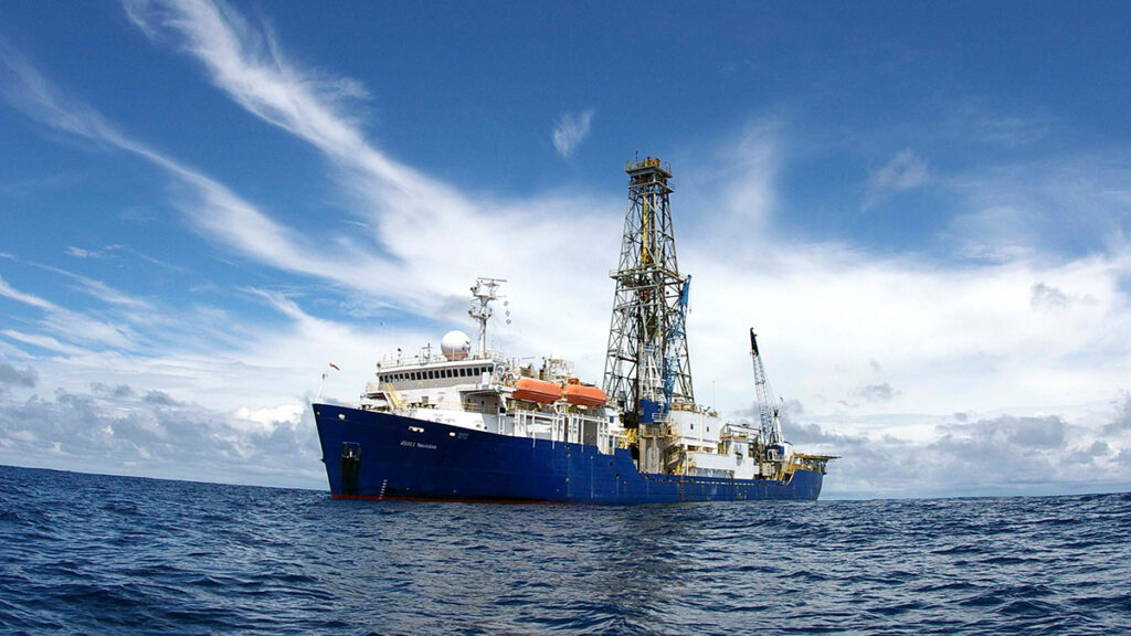 A large research vessel on the ocean on a sunny day
