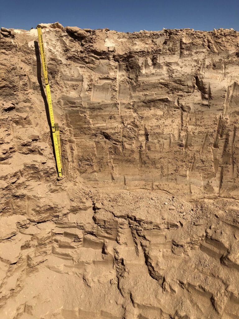 A meter stick shows meters of subsurface in the Atacama Desert.