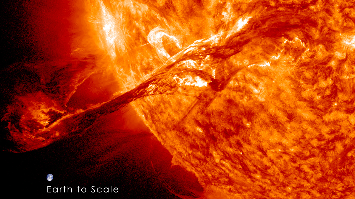 Artist’s depiction of a huge rope of fire stretching out from the Sun, with Earth pictured to scale, very small in the corner