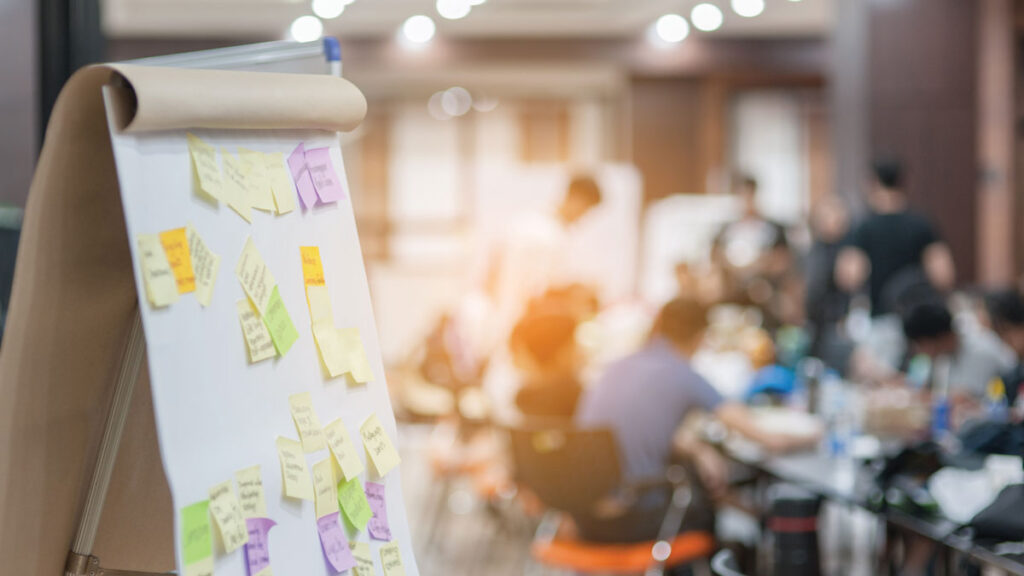 Multicolor sticky notes on a large white board