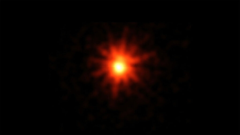 A burst of orange light on a black background.