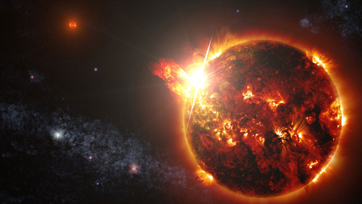 A strong flare explodes from a red-orange star.