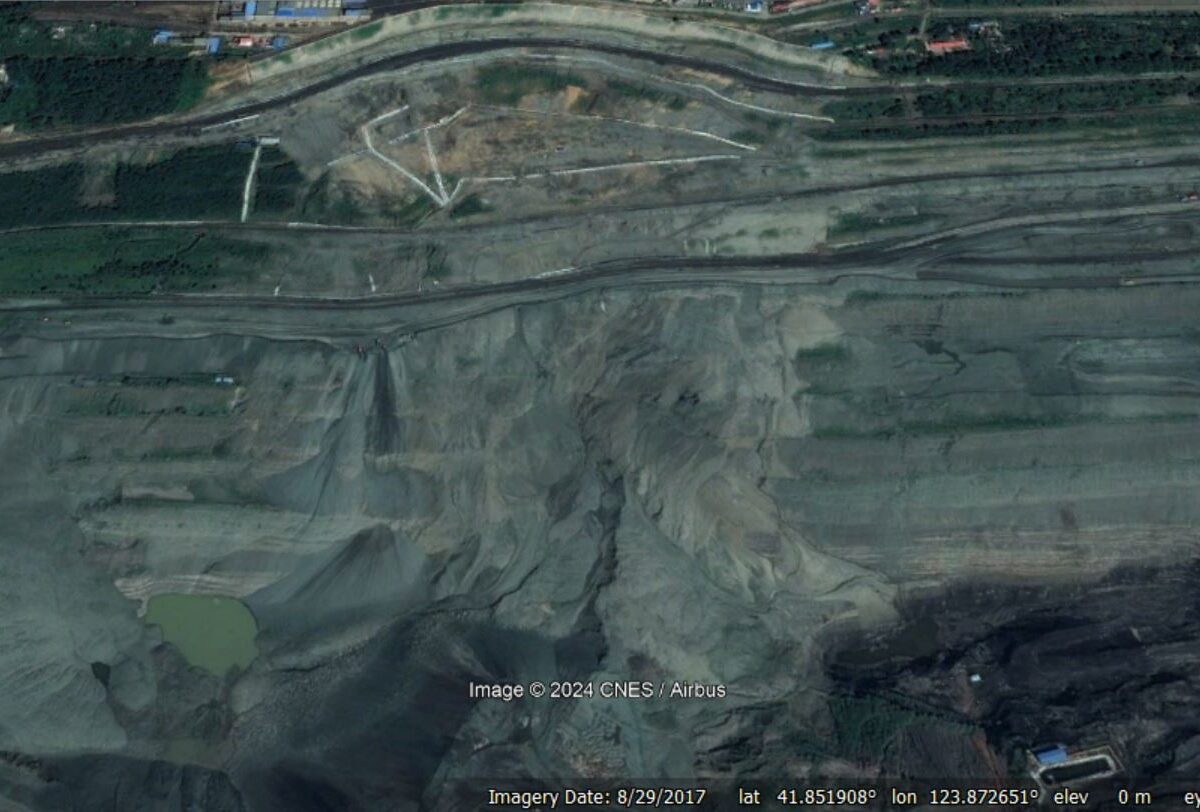 Google Earth image from August 2017 showing the failure at Fushun West OPM.