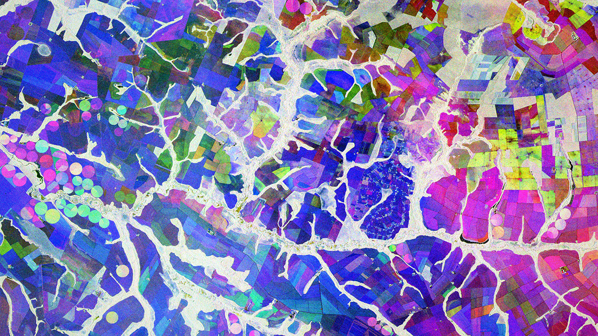 A red-green-blue composite satellite view of farmland in Brazil comprising three images of a single polarization. Stream channels can be seen in white; circular and polygonal patches of land appear in a variety of colors.