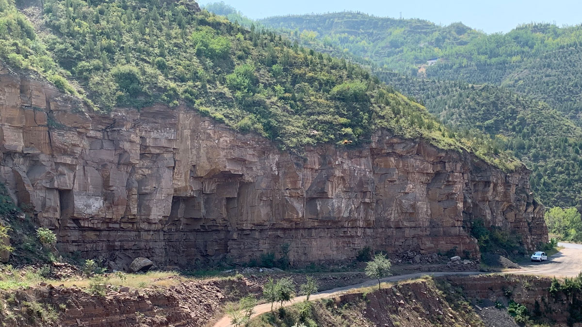 Layers of rock visible in a cliff in Nanliang, Shanxi, China.