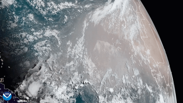 A GIF showing brown dust moving over the ocean