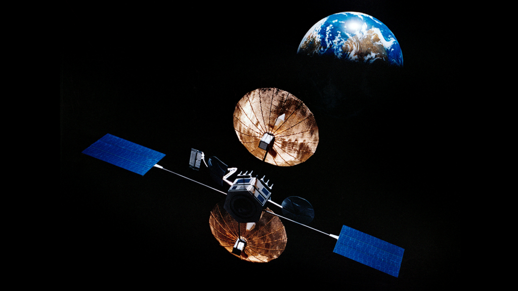In this artist’s rendition, a satellite consisting of two umbrella-shaped instruments and two solar panels is seen in the foreground. In the background, a crescent of Earth is shown in the blackness of space.