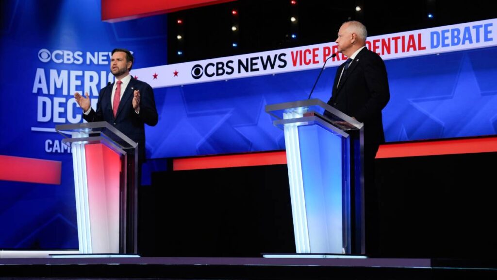 Two men stand at podiums. Behind them is the text “CBS News Vice Presidential Debate.”
