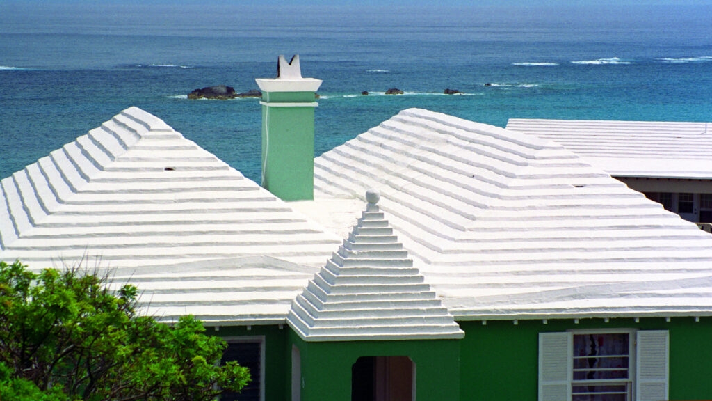 A house with a white roof on a shore in Bermuda