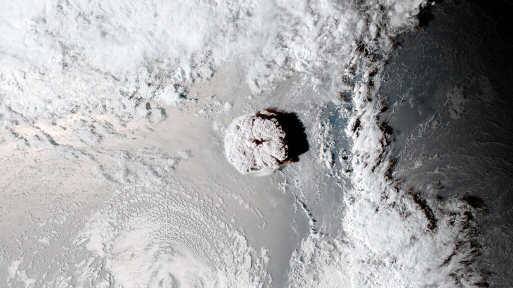 Satellite image of a circular cloud in the center of a partly cloudy sky.