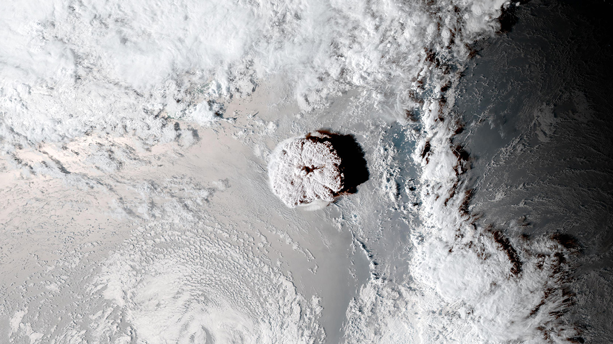 Satellite image of a circular cloud in the center of a partly cloudy sky.
