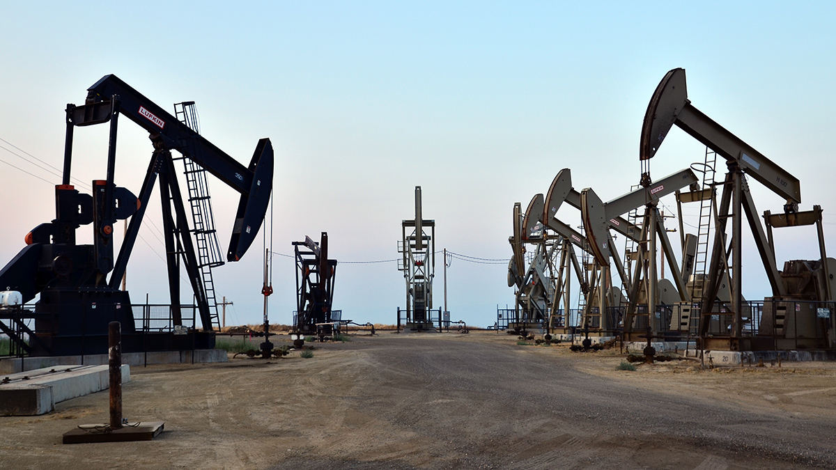 A group of pump wells clustered in an open area on Bureau of Land Management land in California