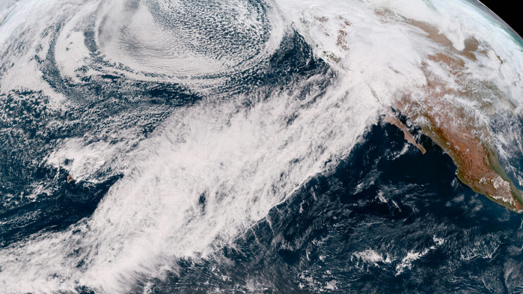 A satellite image of an atmospheric river over the ocean heading toward California