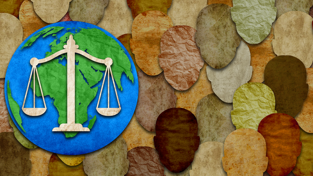 Illustration depicting a scale of justice and Earth overlying a background created from paper cutouts of blank faces of different colors.