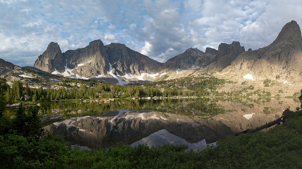 A lake surrounded by rocky mountains