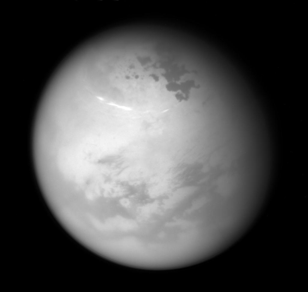 Black-and-white image of a planet with some blurry surface features visible