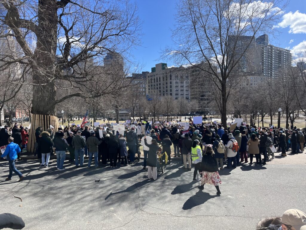 A crowd in front of a city park