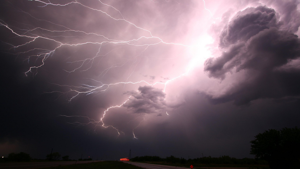 A photo of lightning bolts being emitted from a storm cloud.