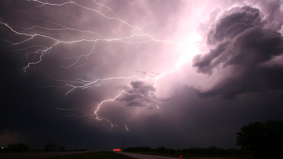 A photo of lightning bolts being emitted from a storm cloud.
