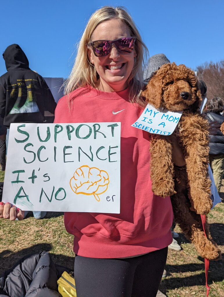 Protest sign: Support Science, it's a no brainer Protest sign attached to an adorable dog: My mom is a scientist