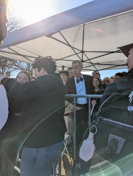 Bill Nye, the Science Guy, shakes hand in the speakers' tent at the Stand Up for Science Rally in Washington, D.C.