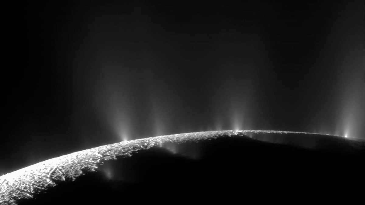 The gray surface of Enceladus with plumes of gas escaping from the surface into space