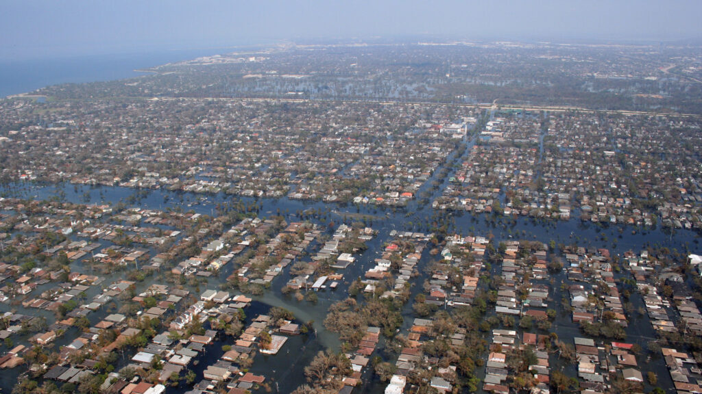 An overhead view of a grid of flooded streets.