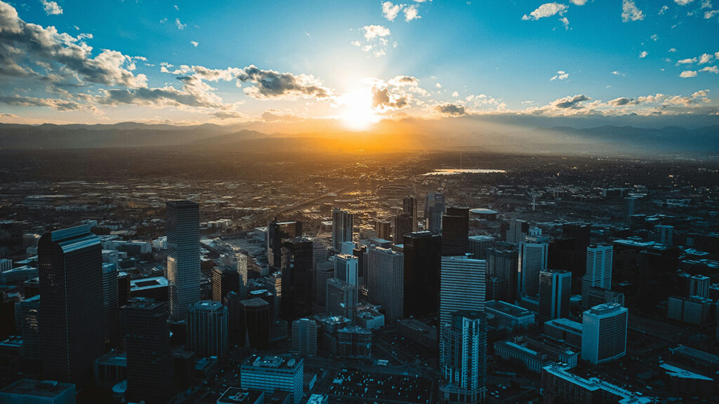Downtown Denver and the surrounding area, with the Sun low in the sky