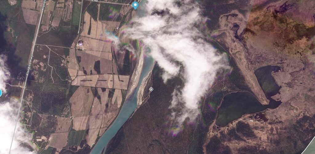 Satellite image of the aftermath of the May 2025 landslide on the Yukon River. Image copyright Planet Labs, collected on 5 June 2025.