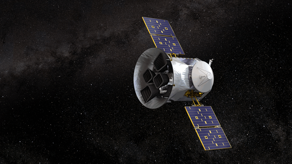 A barrel-shaped space telescope with solar array “wings” looks into starry space.