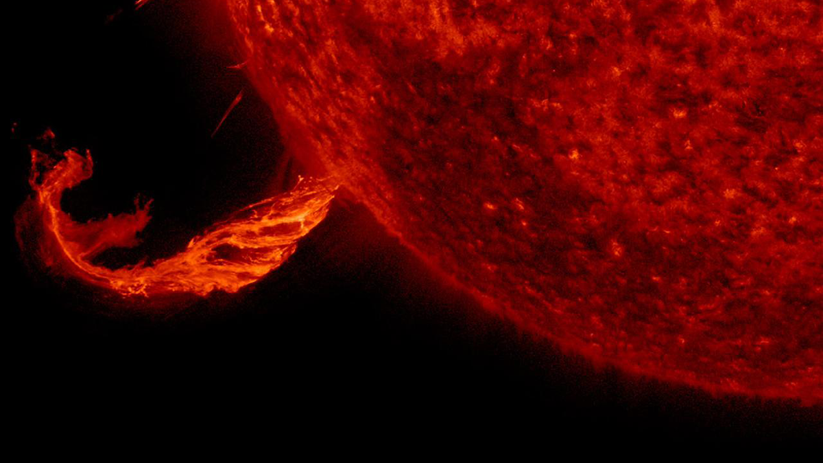 A plume of material erupting from the Sun.