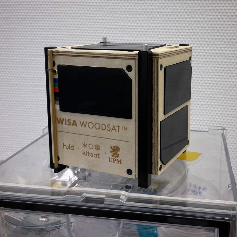 A cubic satellite on a clear tabletop