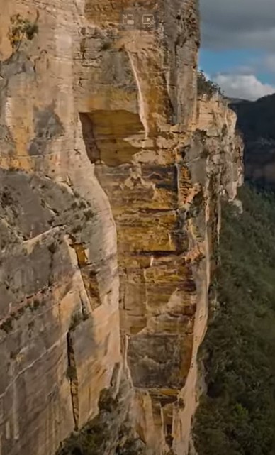 A still from a drone video collected a week before the 1-2 August 2025 rockfall at Carne wall in the Blue Mountains of Australia.