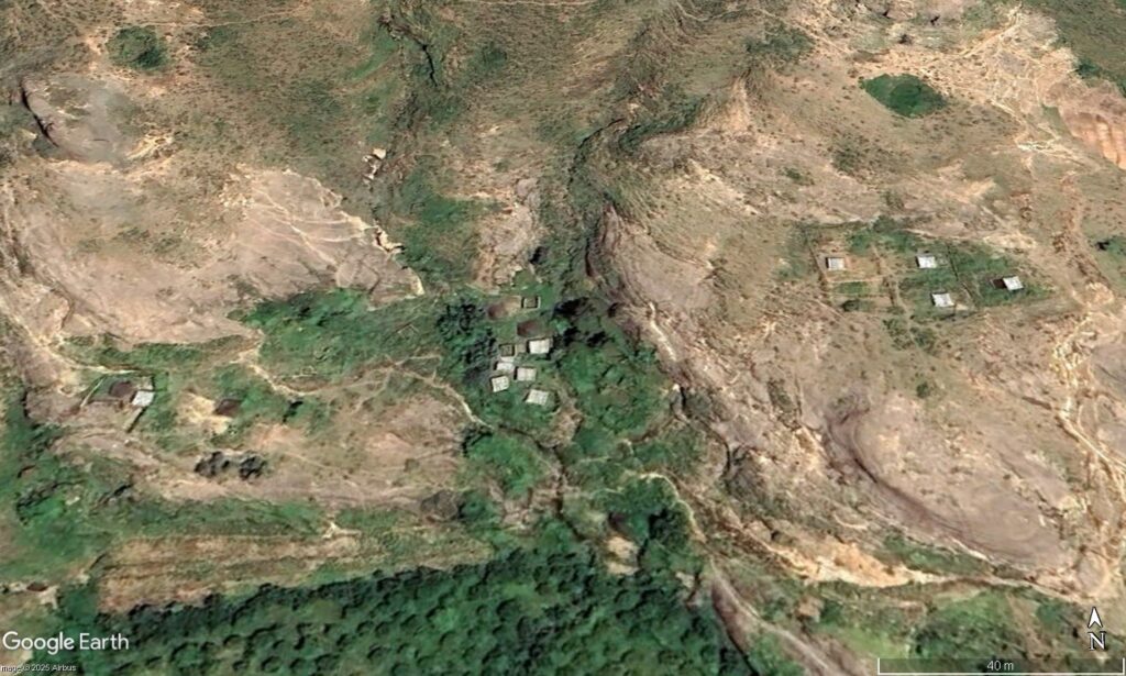A cluster of buildings subsequently destroyed by the 31 August 2025 landslides in Sudan. Google Earth image from 2023.