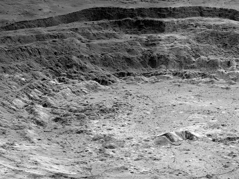 Gravity with an “Edge”: What Lies Beneath Aristarchus Crater