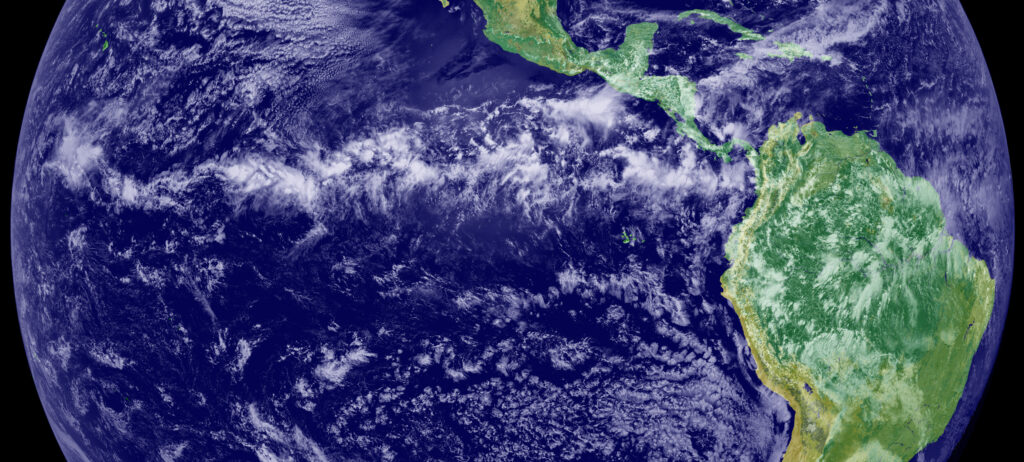 A satellite image of the Intertropical Convergence Zone (ITCZ), visible here as a band of clouds circling Earth near northern South America.