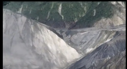 An images of the aftermath of the Matai'an landslide dam breach.