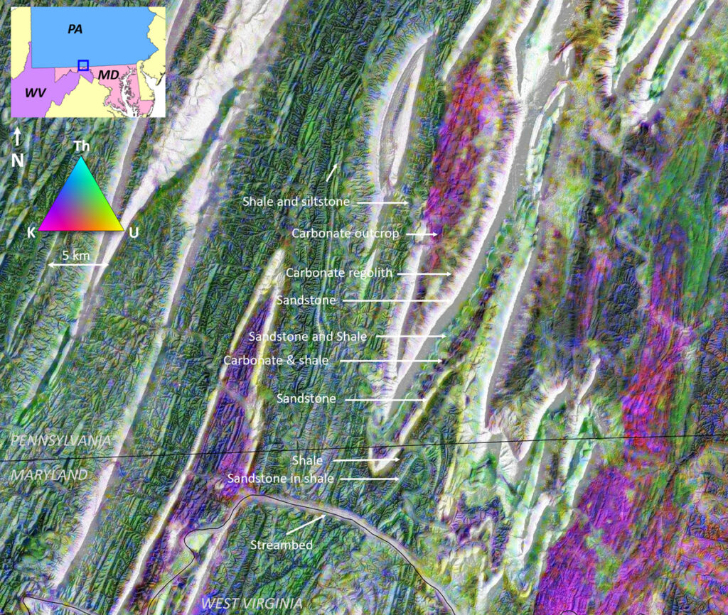 Shaded relief map showing portions of Maryland, Pennsylvania, and West Virginia, with a color scale denoting areas where radiometric potassium (magenta), thorium (cyan), and uranium (yellow) were detected