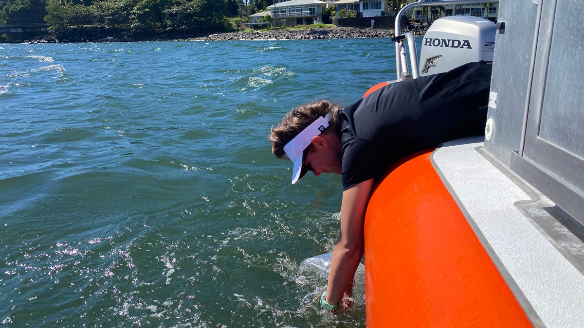 Research scientist Kelly Hondula gathers water samples from submarine groundwater discharge sites along the Hawaiian coast.