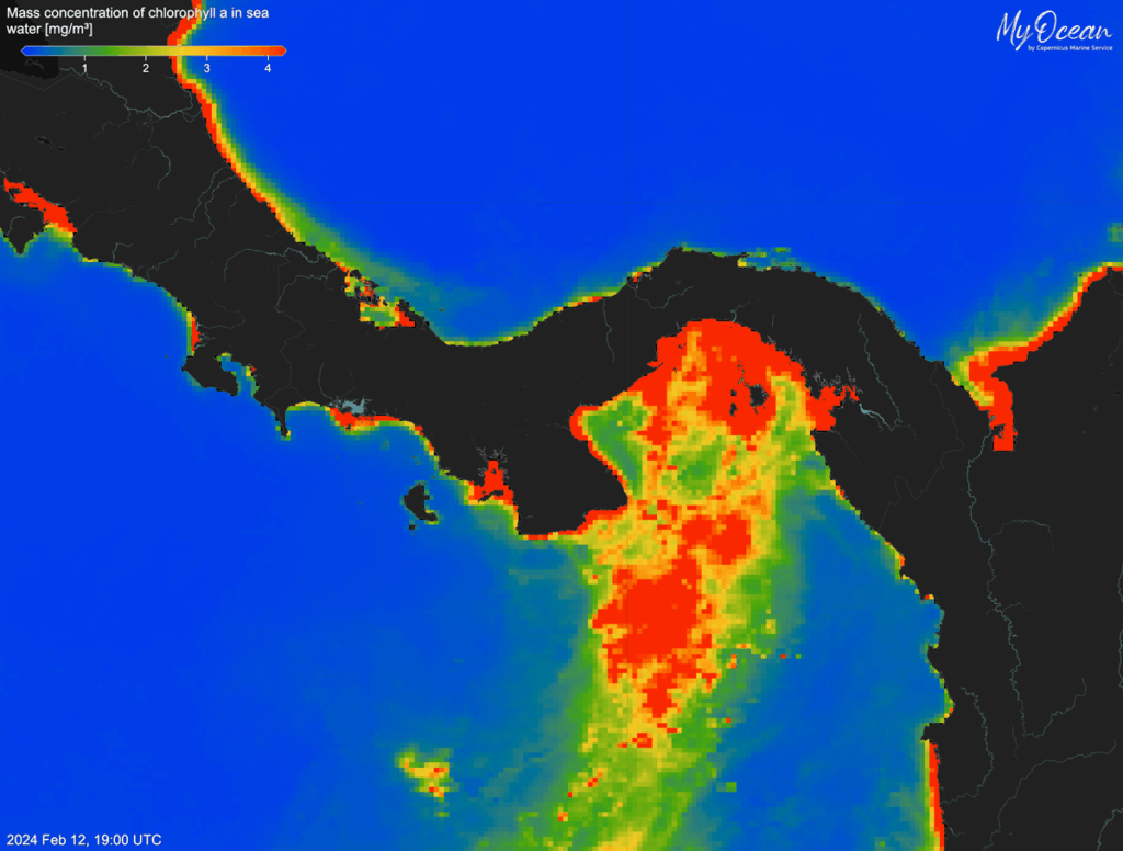 A satellite image of Panama shows a bloom of red, yellow, and green colors in the water off its Pacific coast.