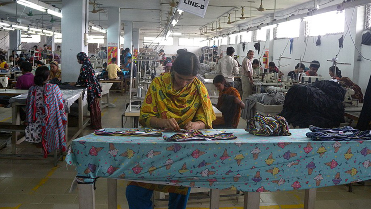 People sew clothing in a Bangladeshi garment factory.